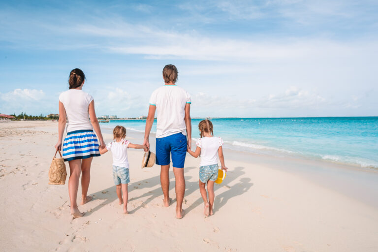 Young family with children on the beach