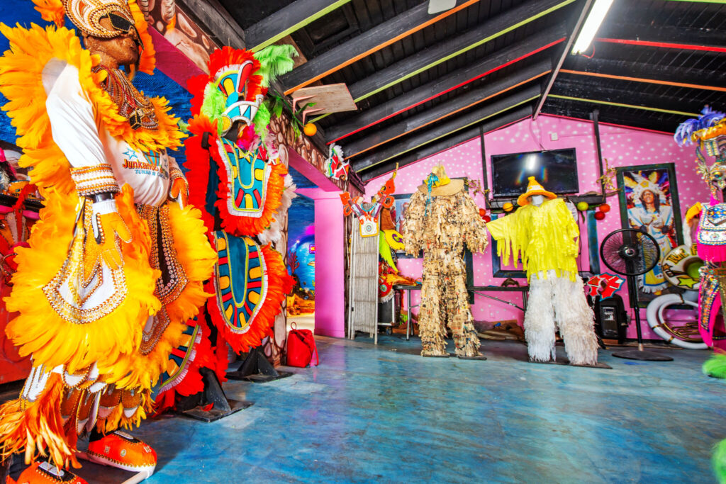 Visitors are welcome to try on some of the colorful costumes housed within the Junkanoo Museum.