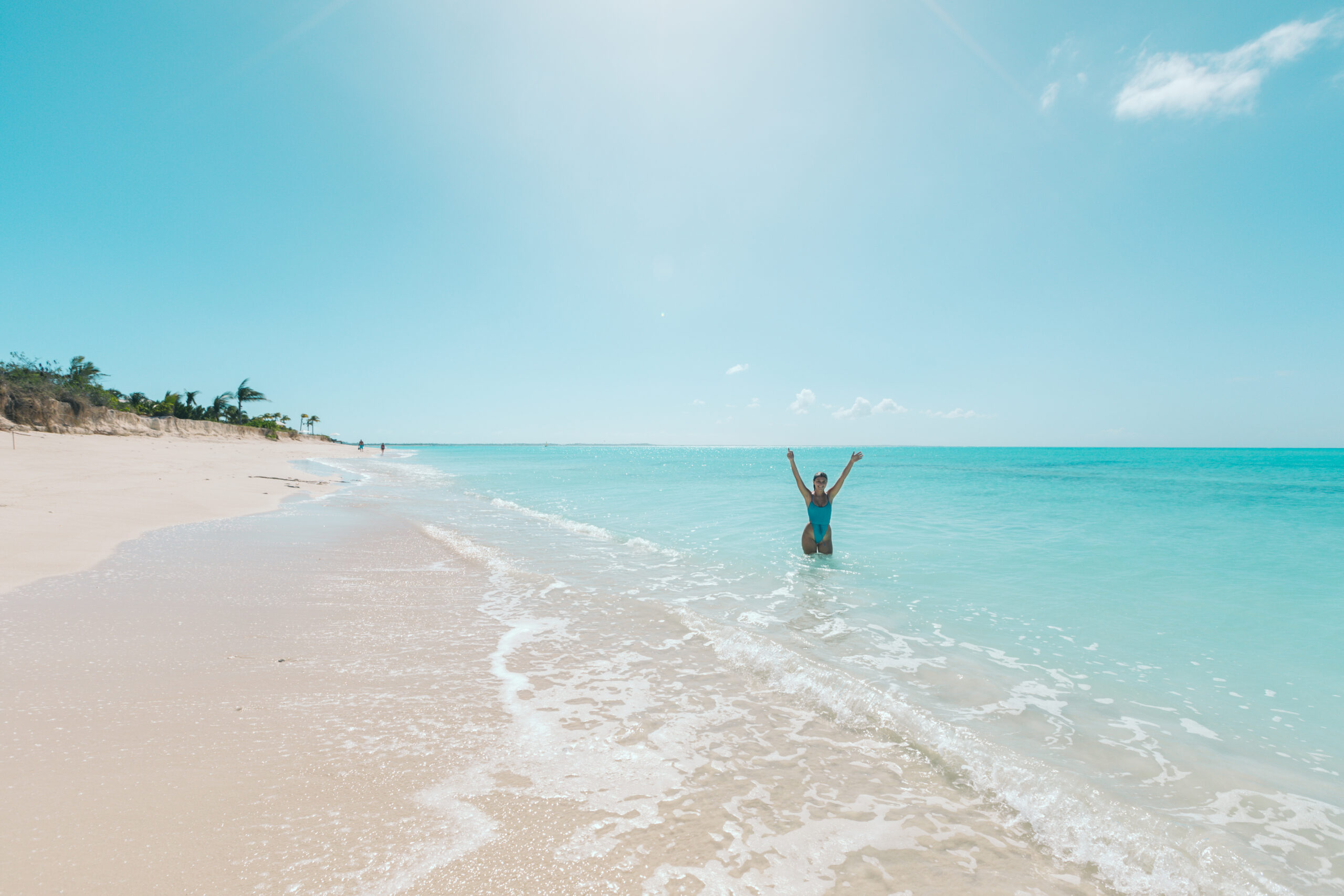 A photo of a woman enjoying Villa Camilla's private Grace Bay Beach access.
